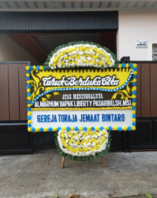 Papan Bunga Duka di Luas